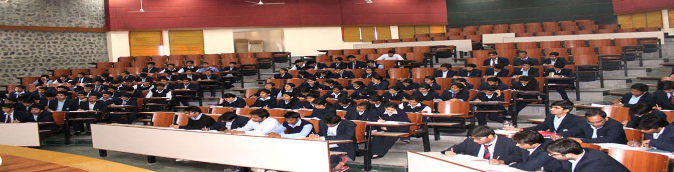 Students dress in University Uniform during the examination in Lecture Theatre 5